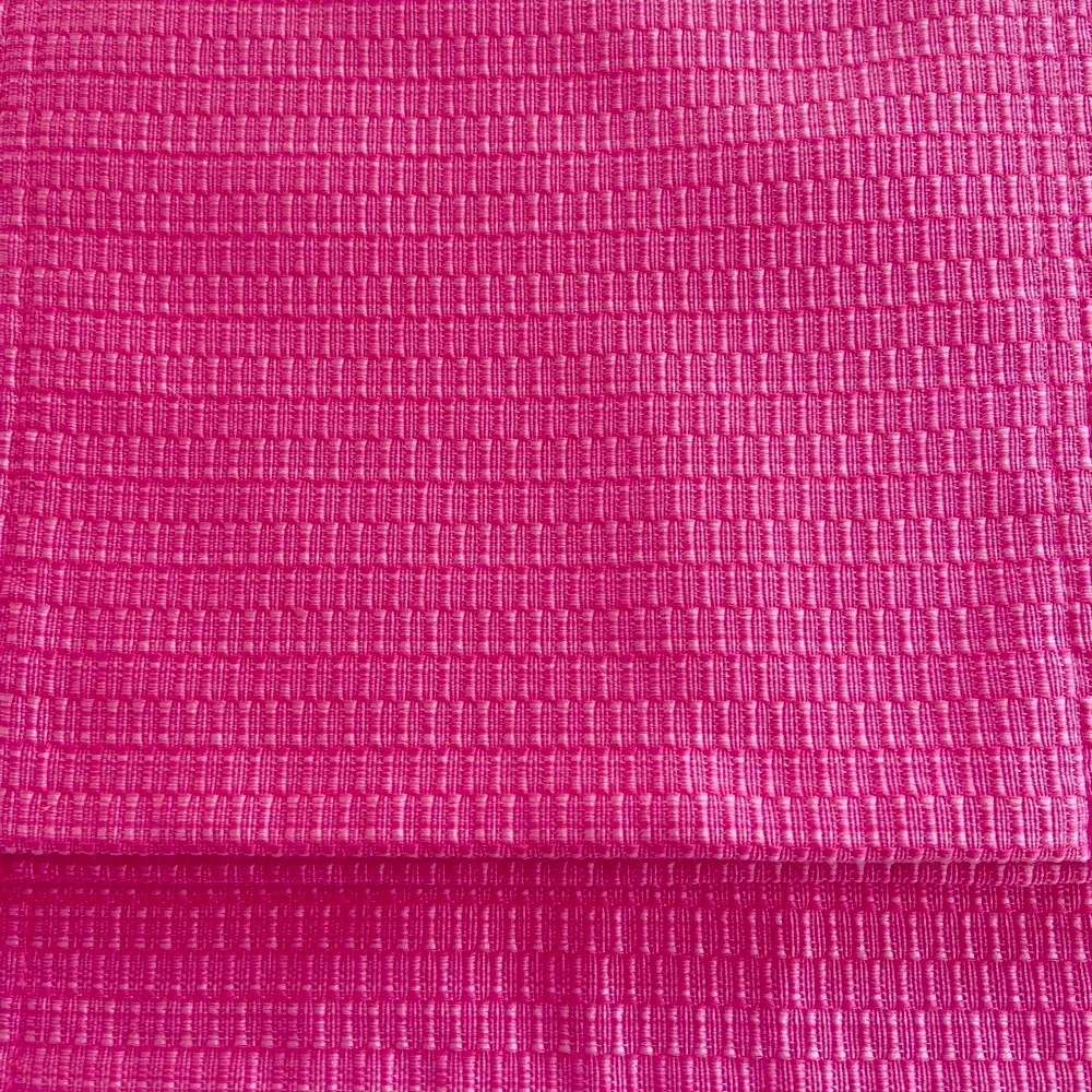 Set of four pink placemats with pink ribbon